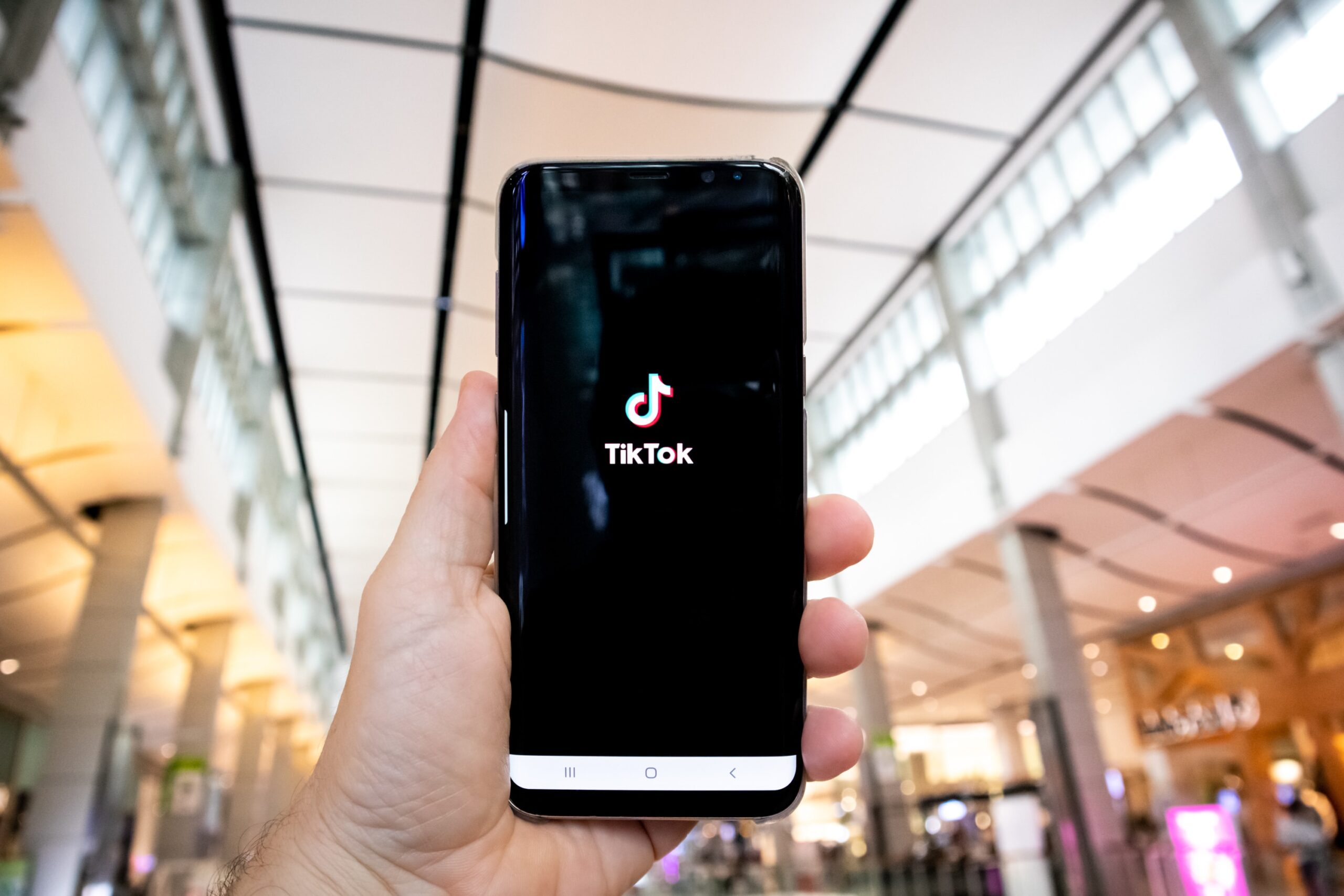 cell phone with TikTok on the screen